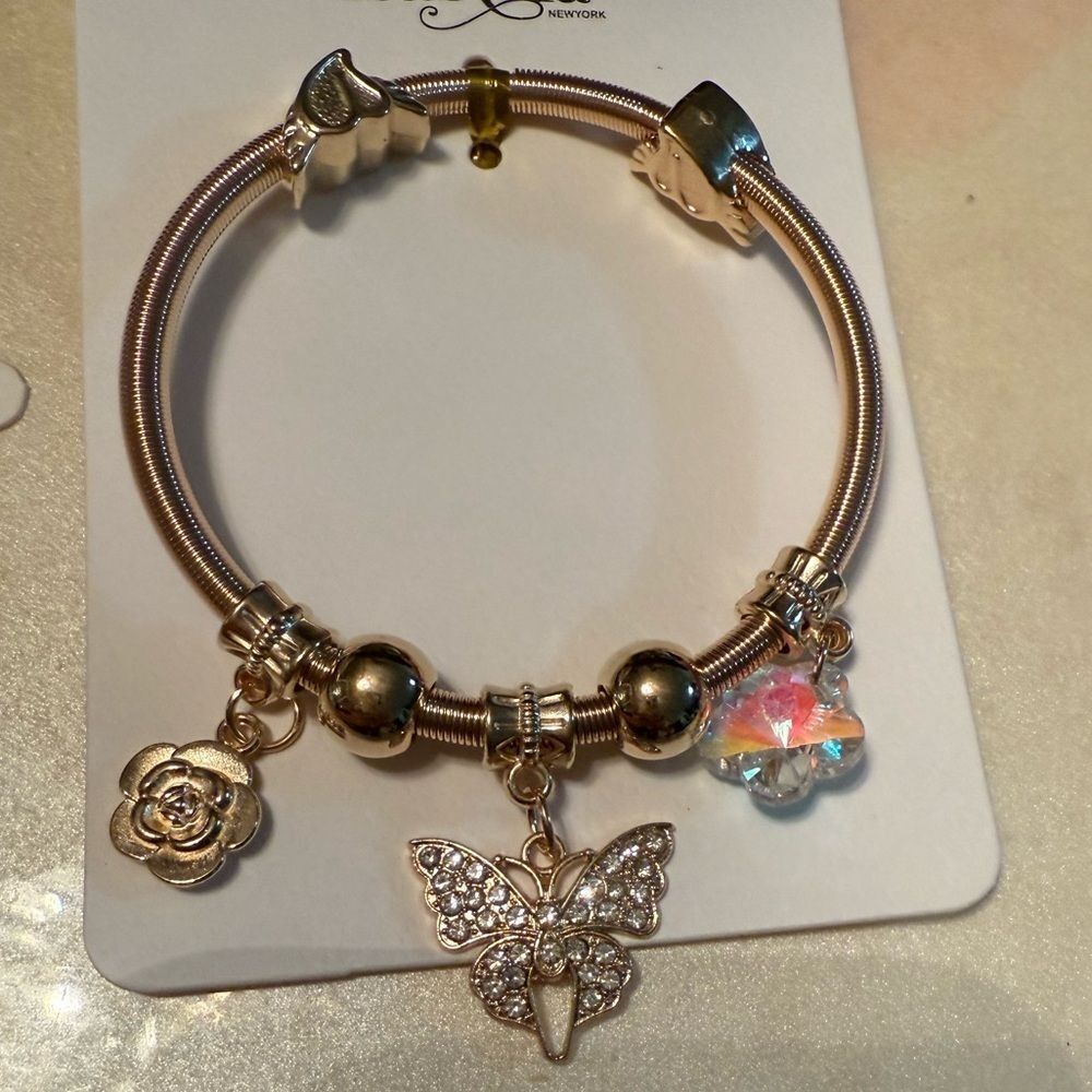 Isabella New York Gold Charm Bracelet with Butterfly and Flower Accents